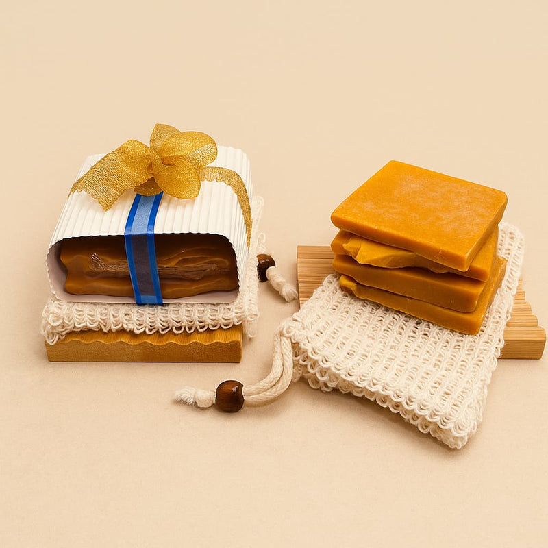 brightening kojic and turmeric soap ends bundle gift packaged with gold ribbon against dark concrete background representing best natural brightening skincare Australian made.