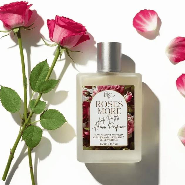 Luxury Hair Perfume bottle labeled 'Roses More' with pink roses and petals on a white background