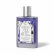 Bottle of Sweet Pea hair perfume with a floral label on a white background