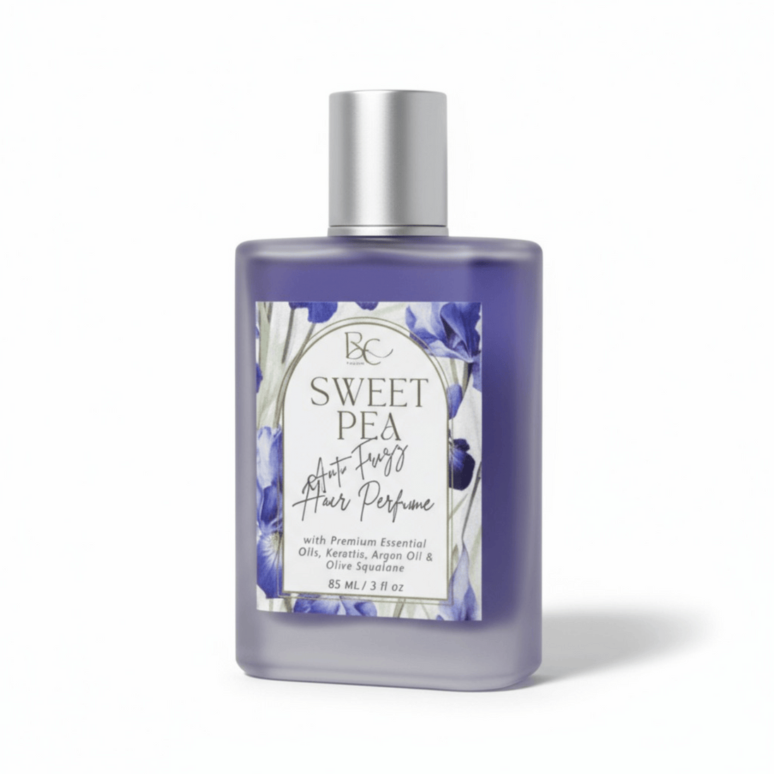 Bottle of Sweet Pea hair perfume with a floral label on a white background
