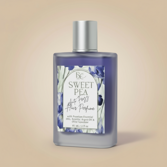 Bottle of Sweet Pea hair perfume - Luxury hair mist with argan oil, keratin, and rose essential oils for anti-frizz, shine and long lasting fragrance