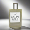 Glass perfume bottle with silver cap against light gray backdrop with soft shadows representing luxury men’s Australian made perfume.