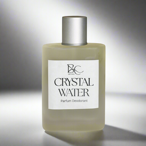 Glass perfume bottle with silver cap against light gray backdrop with soft shadows representing luxury men’s Australian made perfume.