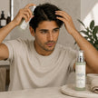 minoxidil hair growth serum being applied by male to hair and scalp representing best hair growth solutions for males australian made.