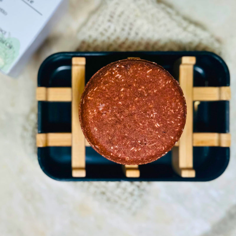 Bubble Clinic Minoxidil Shampoo Bar on a soap tray with biotin, saw palmetto and rosemary highlighted.