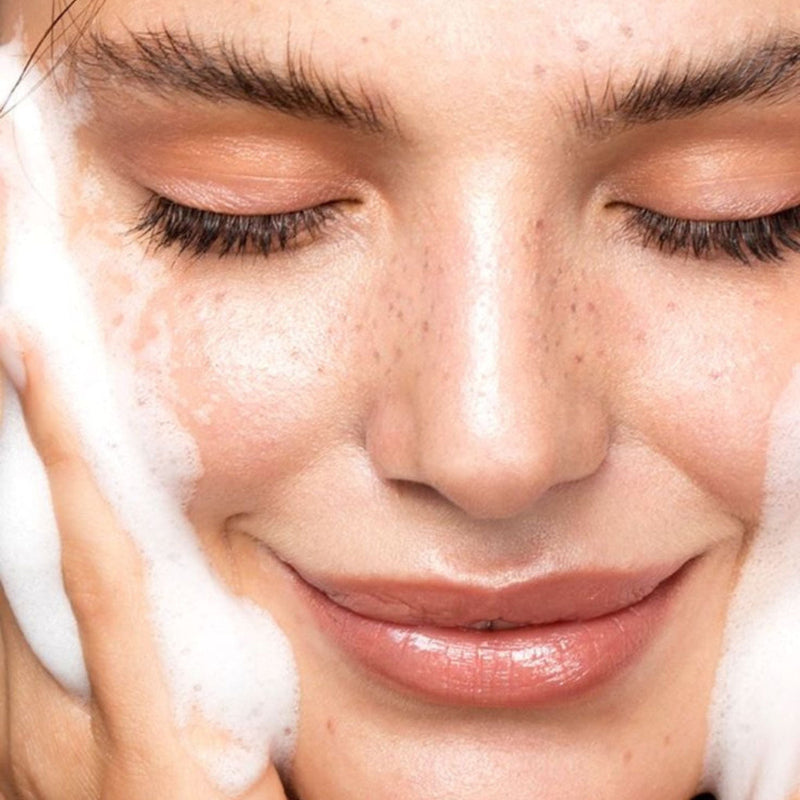 close up of smiling girl's face with soft creamy lather from natural clean skincare routine on her cheeks representing natural Australian Skincare.