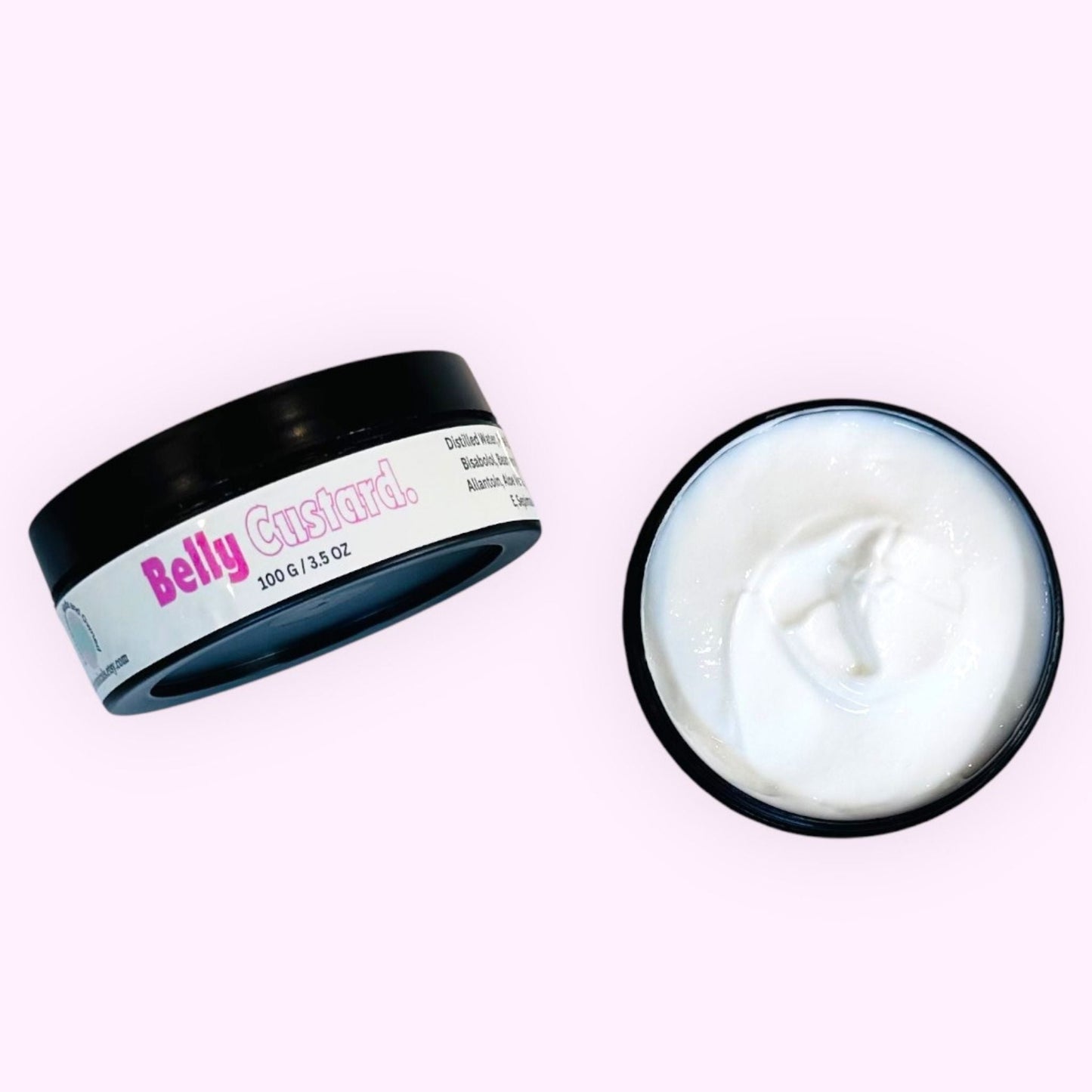 Two jars of belly custard, one unlidded to reveal a bright white, creamy, light, and luxurious belly moisturiser, set against a luminous pink background.