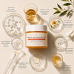 Luxury flat lay of the Bubble Clinic Peptides Anti Aging Jelly Mask surrounded by laboratory glassware, peptide-inspired ingredients and botanical extracts, highlighting the science-backed formula with Matrixyl 3000, Acetyl Hexapeptide-8, Ferulic Acid, Glutathione, Niacinamide, Hyaluronic Acid and Trehalose.