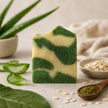 Close-up of handcrafted Aloe & Plantain Soap showing its natural swirl design and creamy artisan finish.