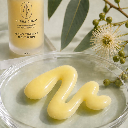 Creamy milky texture of Bubble Clinic Retinol Tri-Active Night Serum with frosted 50 mL bottle and Australian botanical styling