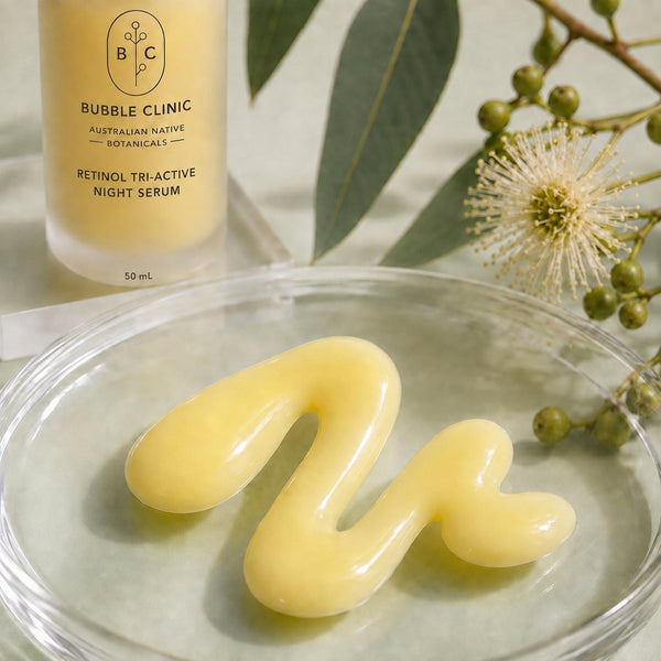 Creamy milky texture of Bubble Clinic Retinol Tri-Active Night Serum with frosted 50 mL bottle and Australian botanical styling