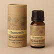 container and bottle of pure Roman Chamomile Essential Oil on a beige background representing best pure premium essential oils Australia. 