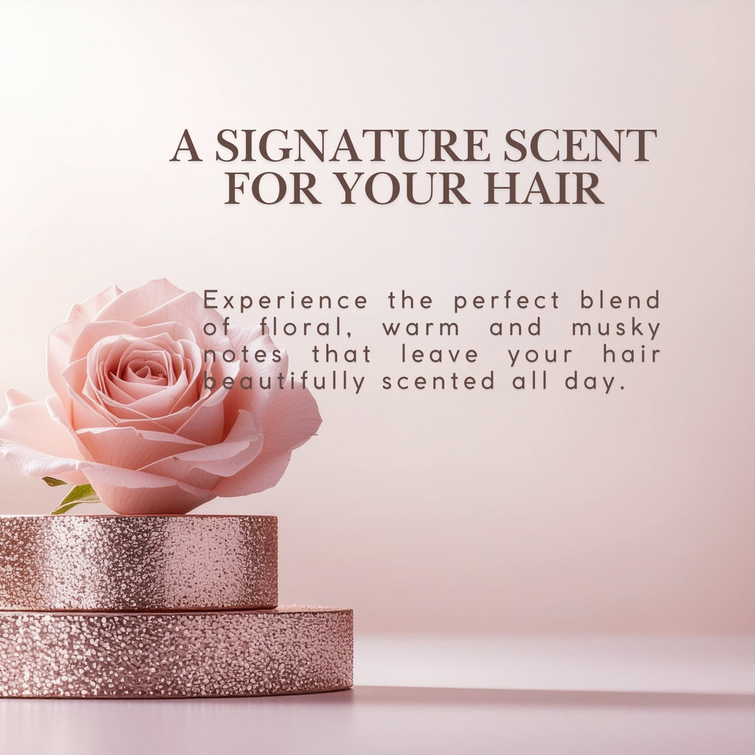 Pink rose on a pink background with text about a signature scent for hair - perfect blend of floral, warm and musky notes for all day hair fragrance.