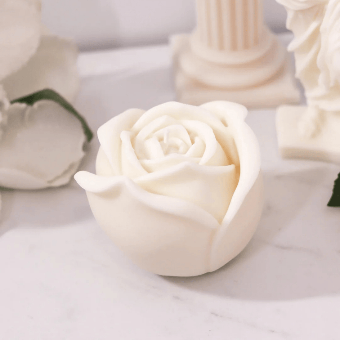 Rose shaped candle against a luxurious and rich ambient backdrop - Bubble Clinic