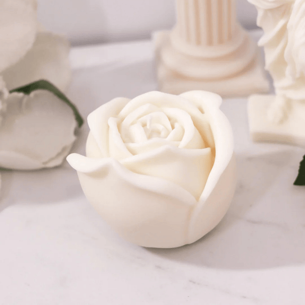 Rose shaped candle against a luxurious and rich ambient backdrop - Bubble Clinic