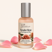 Bottle of smaller Blooms Australia Tender Rose perfume Fine Fragrance Mist with pink rose petals on a light beige background representing natural australian perfumes and fragrances