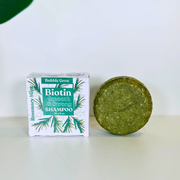 close up of nourishing shampoo bar delivers a rich lather, invigorating aromatherapy, and long-lasting results. Free from sulfates, parabens, silicones, and harsh detergents against white backdrop representing natural australian haircare.