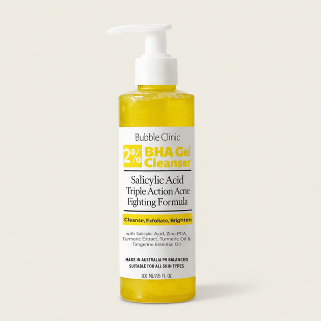 Bottle of Bubble Clinic 2% Salicylic Acid and Turmeric BHA Gel Cleanser with lemon slices on a white background representing pure, natural, clean Australian skincare for acne.