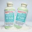Biotin Boost shampoo and conditioner bottles on a white background representing natural Australian Made Clarifying Shampoo.