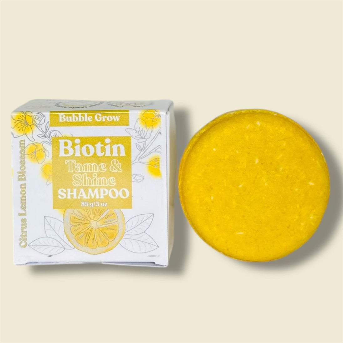 close up of yellow, turmeric biotin shampoo bar Turmeric & Rice Protein  Helps smooth frizz, tame flyaways, and promote shine while supporting scalp balance. with no nasty chemicals or sulfates