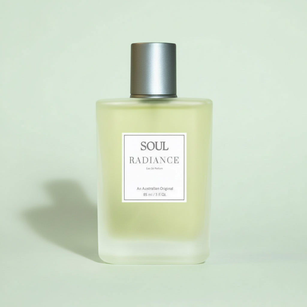 Perfume Bottle with silver cap of Soul Radiance Citrus Fruity Aromatherapy Perfume on a beige background representing Australian aromatherapy perfumes with essential oils. 