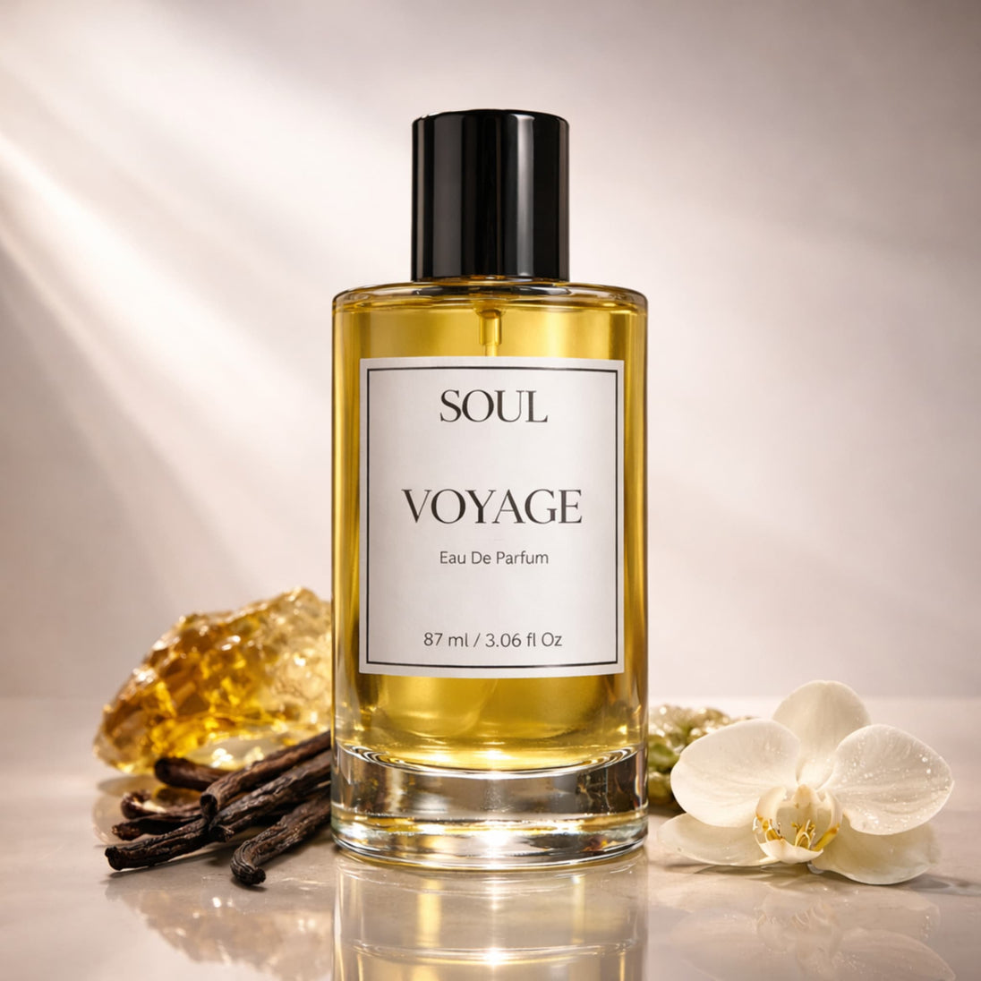 Perfume bottle labeled 'Soul Voyage' with vanilla beans and an orchid on a reflective surface representing best australian original luxury perfume with essential oils.