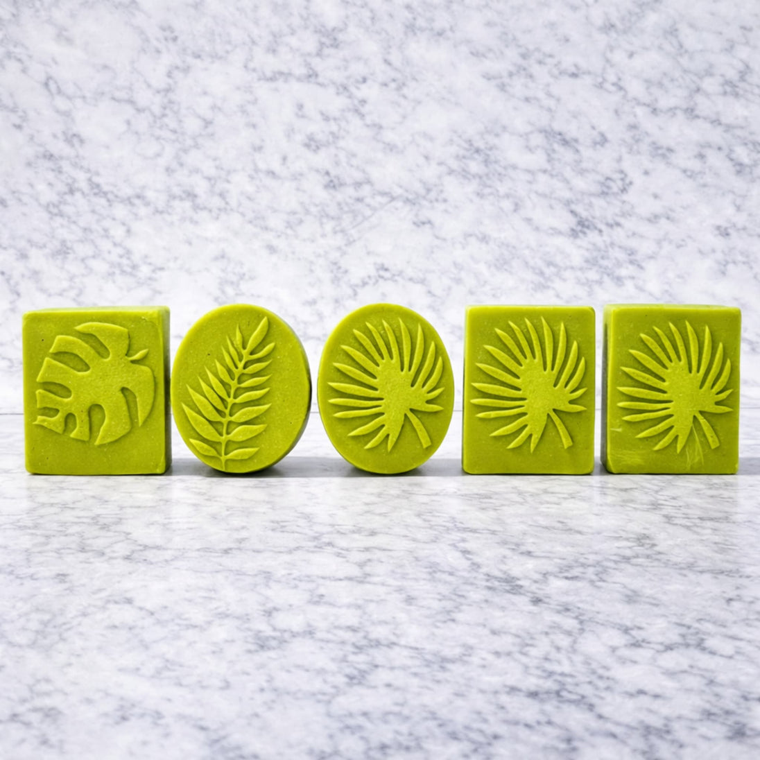 green sulfur cleansing bars with MSM and salicylic acid to target blemishes and troubled skin on a light marble surface representing best australian made cleansers for blemishes and oily skin.