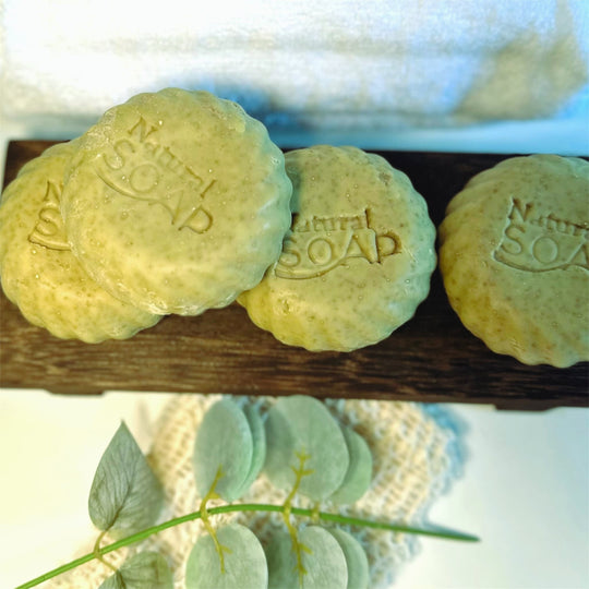 close up top view of 4 natural sulphur soap bars for acne and rosacea with emu oil and infused with comfrey, spirulina, moringa and wheatgrass giving the soap a natural green colour. 