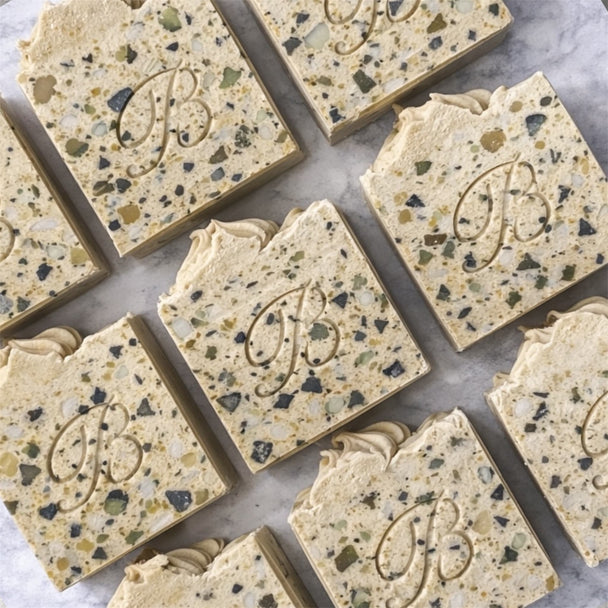 Natural Sulphur terrazzo-style soap bars with a textured surface for blemishes and troubled skin with a brand logo on a marble surface representing natural Australian skincare for blemishes and troubled skin