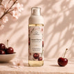 Sweet Cherry Body Mist by Bubble Clinic styled with cherries and soft pink blossoms