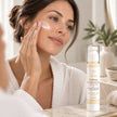 Woman applying Bubble Clinic tallow moisturiser Australia with peptides as part of facial skincare routine