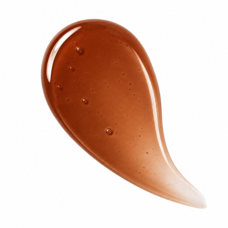 Toffee tinted lip oil swatch in warm caramel brown glossy finish