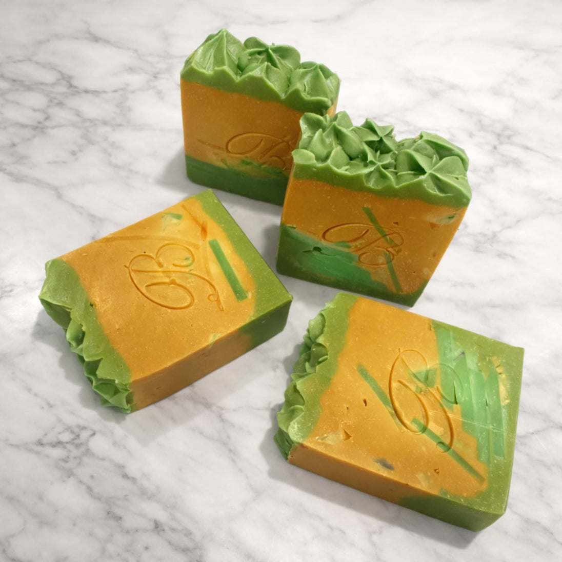 Close up of natural brightening Turmeric Kojic acid soap with Alpha Arbutin for even skin tone on a marble surface representing best brightening soaps Australian made. 