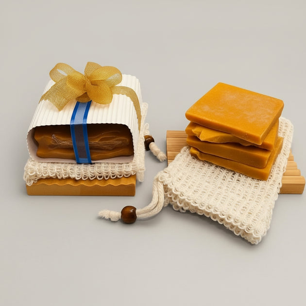 turmeric and kojic acid soap ends bundle including natural sisal soap pouch and bamboo soap dish with gold ribbon against a clean beige background. 