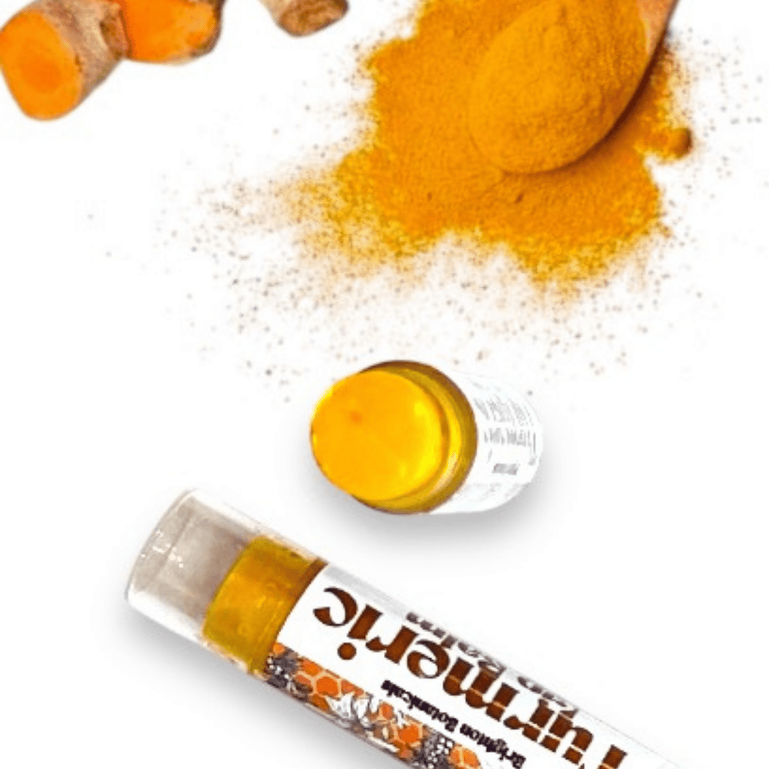 Natural lip brightening lip balm tubes. Close up showcases bright, natural orange hue from turmeric with organic turmeric in the background.