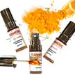 luxury brightening lip mask bottles and applicator with organic turmeric in the background for plumping, rejuvenating and brightening dark lips.