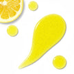 Yellow swatch and droplets of the liquid turmeric gel cleanser and lemon slice on a white background revealinc crystal clear, clean acne fighting deep pore cleansing formula.