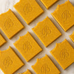 close up of flat laid Natural Brightening Turmeric Kojic Acid Soap Bars with essential oils, grass fed beef tallow, extra virgin olive oil, castor oil and coconut oil - Handmade Facial and body Cleansing Soap for Dark Spots, Acne Marks, Uneven Skin Tone and Glowing Skin Australia
