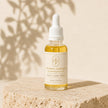Bubble Clinic Vitamin C Radiance Face Oil product detail with visible golden oil and white dropper.