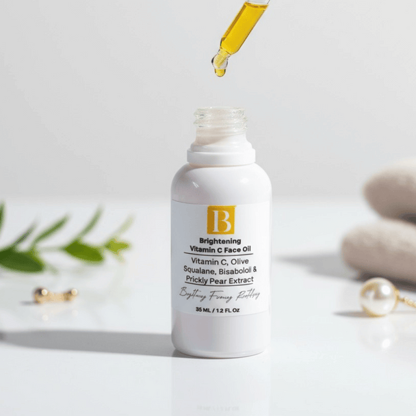 white ceramic bottle with dropper over it revealing clear yellow hue of vitamin c oil with prickly pear on a white background with botanicals and towels representing clean natural australian skincare