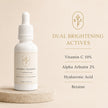 10% vitamin C, 2% alpha arbutin, sodium hyaluronate and betaine serum actives on a clean beige backdrop with listed dual brightening actives including 10% vitamin c, 2% alpha arbutin