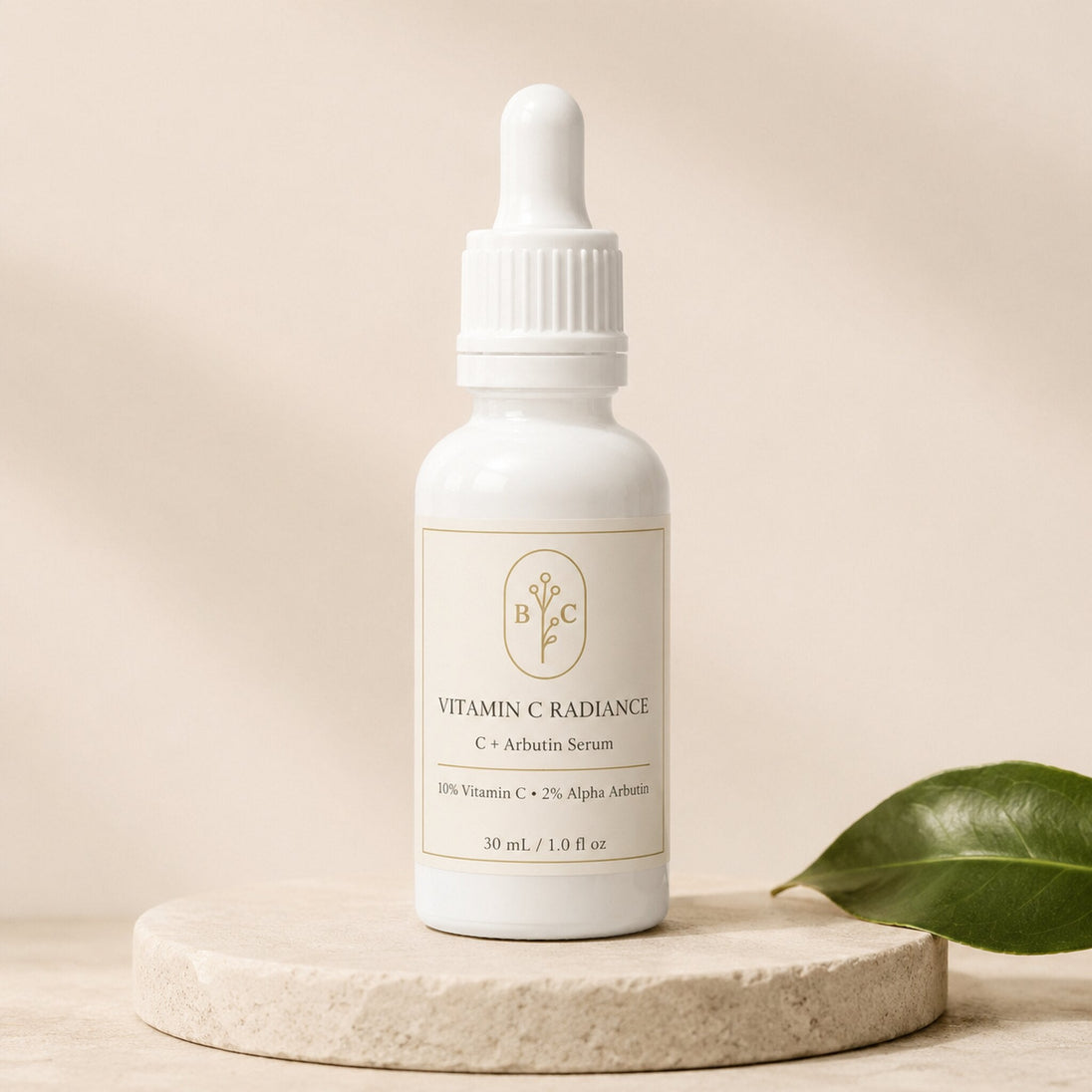 Bubble Clinic Vitamin C Radiance C + Arbutin Serum, 30 mL dropper bottle with 10% Vitamin C and 2% Alpha Arbutin on a neutral stone pedestal