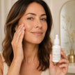 Woman applying Bubble Clinic Vitamin C and Alpha Arbutin Serum to her cheek