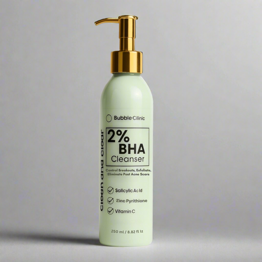 Bottle of Bubble Clinic 2% BHA Cleanser with a gold pump on a gray background representing best australian acne cleansers.