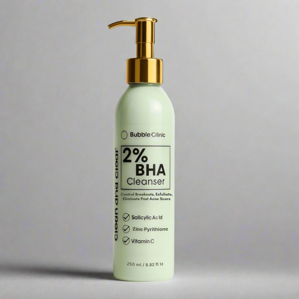 Bottle of Bubble Clinic 2% BHA Cleanser with a gold pump on a gray background representing best australian acne cleansers.