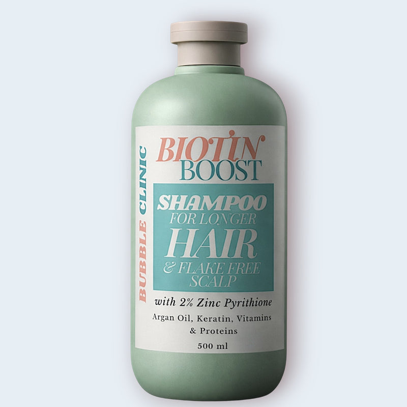 Biotin Boost shampoo bottle with a white label on a light gray background